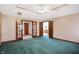 Main bedroom with green carpet and access to bathroom and hallway at 6640 Greenridge Dr, Indianapolis, IN 46278