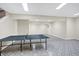 Finished basement recreation room with ping pong table and tiled floor at 6640 Greenridge Dr, Indianapolis, IN 46278