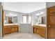 Spacious bathroom with walk-in tub, double vanity, and separate shower at 6640 Greenridge Dr, Indianapolis, IN 46278