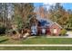 Brick house with a large yard and basketball hoop at 6640 Greenridge Dr, Indianapolis, IN 46278