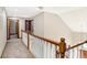 Upstairs hallway with hardwood floors and white railings at 6640 Greenridge Dr, Indianapolis, IN 46278