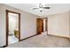 Bright bedroom with ceiling fan and en-suite bathroom access at 6640 Greenridge Dr, Indianapolis, IN 46278