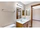 Bathroom with vanity, mirror, and a linen towel rack at 6640 Greenridge Dr, Indianapolis, IN 46278
