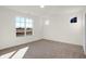 Well-lit bedroom with neutral walls and carpet, featuring two windows at 7171 Rose Hill Ave, Brownsburg, IN 46112