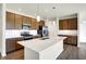 Modern kitchen with an island and stainless steel appliances at 7171 Rose Hill Ave, Brownsburg, IN 46112