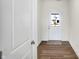 Bright entryway with wood-look floors and white doors leading to other rooms at 7171 Rose Hill Ave, Brownsburg, IN 46112
