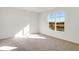 Bright bedroom with carpeted floor and large window offering a scenic view at 7171 Rose Hill Ave, Brownsburg, IN 46112