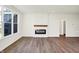 Living room featuring a fireplace and large windows at 7171 Rose Hill Ave, Brownsburg, IN 46112