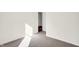 Spacious bedroom with carpet and access to another room at 7171 Rose Hill Ave, Brownsburg, IN 46112