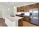 Modern kitchen features stainless steel appliances and an island at 7171 Rose Hill Ave, Brownsburg, IN 46112