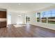 Spacious dining area with large windows and wood-look floors at 7171 Rose Hill Ave, Brownsburg, IN 46112