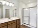 Modern bathroom featuring a vanity with a white countertop and a shower stall at 7171 Rose Hill Ave, Brownsburg, IN 46112