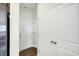 Laundry area with white doors and wood flooring at 7171 Rose Hill Ave, Brownsburg, IN 46112