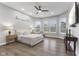 Spacious main bedroom with hardwood floors and ceiling fan at 3577 Idlewind Dr, Westfield, IN 46074
