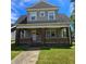 Two-story house with brick facade and a front porch at 709 W Riverside Ave, Muncie, IN 47303