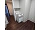 Small kitchen with a freestanding stove and overhead shelving at 709 W Riverside Ave, Muncie, IN 47303