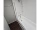Clean bathroom with shower/tub combo and dark floors at 709 W Riverside Ave, Muncie, IN 47303