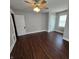 Bright bedroom featuring hardwood floors and ample natural light at 709 W Riverside Ave, Muncie, IN 47303