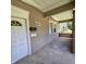Front porch with brick columns and a white door at 709 W Riverside Ave, Muncie, IN 47303