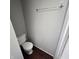 Simple toilet and small bathroom at 709 W Riverside Ave, Muncie, IN 47303