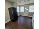 Kitchen with black refrigerator and dark floors at 709 W Riverside Ave, Muncie, IN 47303