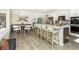 Modern kitchen features a large island with seating and stainless steel appliances at 18415 Depoe Ln, Westfield, IN 46074