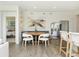 Charming breakfast nook with built-in bench seating and kitchen views at 18415 Depoe Ln, Westfield, IN 46074