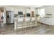 Modern kitchen with white cabinets, stainless steel appliances, and an island at 18415 Depoe Ln, Westfield, IN 46074