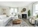 Spacious living room with a fireplace and large windows at 18415 Depoe Ln, Westfield, IN 46074