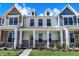 Three-story townhouses with front porches and landscaping at 3889 Wren Dr, Brownsburg, IN 46112