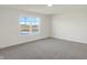 Bright bedroom with large window and neutral carpeting at 5870 Fair Oak Cir, Brownsburg, IN 46112