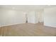 Spacious living room with light walls and wood-look flooring at 7144 Rose Hill Ave, Brownsburg, IN 46112