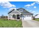 Craftsman style home with gray siding and white trim at 7144 Rose Hill Ave, Brownsburg, IN 46112