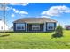 Gray house with covered patio and grassy yard at 7144 Rose Hill Ave, Brownsburg, IN 46112
