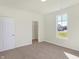 Spacious bedroom with window, closet and neutral carpeting at 7144 Rose Hill Ave, Brownsburg, IN 46112