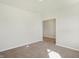 Bright office with neutral walls and carpeting, offering access to another room at 7144 Rose Hill Ave, Brownsburg, IN 46112