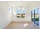 Sunlit dining area featuring hardwood floors and backyard access at 7144 Rose Hill Ave, Brownsburg, IN 46112