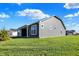 Gray house with covered patio and grassy yard at 7144 Rose Hill Ave, Brownsburg, IN 46112
