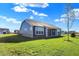 Gray house with covered patio and grassy yard at 7144 Rose Hill Ave, Brownsburg, IN 46112