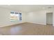 Large living room with hardwood floors and large window at 7144 Rose Hill Ave, Brownsburg, IN 46112