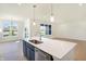 Modern kitchen with island, stainless steel appliances, and lots of natural light at 7144 Rose Hill Ave, Brownsburg, IN 46112