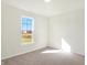 Bright bedroom with large window and plush carpeting at 7144 Rose Hill Ave, Brownsburg, IN 46112