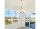 Spacious dining area with hardwood floors and view to backyard at 7144 Rose Hill Ave, Brownsburg, IN 46112