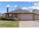 Brick ranch home with attached garage and well-maintained landscaping at 521 Eagle Crest Dr, Brownsburg, IN 46112