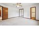 Bright bedroom with ceiling fan and mirrored closet at 521 Eagle Crest Dr, Brownsburg, IN 46112