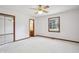 Spacious bedroom with ceiling fan, mirrored closet, and window at 521 Eagle Crest Dr, Brownsburg, IN 46112