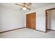 Spacious bedroom featuring a ceiling fan and double closets at 521 Eagle Crest Dr, Brownsburg, IN 46112