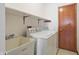 Laundry room with washer, dryer, and utility sink at 521 Eagle Crest Dr, Brownsburg, IN 46112