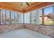 Sunroom with brick walls, window blinds, and ceiling fan at 521 Eagle Crest Dr, Brownsburg, IN 46112