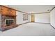 Living room featuring a brick fireplace and ample natural light at 521 Eagle Crest Dr, Brownsburg, IN 46112